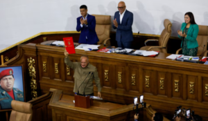Member of the National Assembly and Vice president of the United Socialist Party of Venezuela (PSUV) Diosdado Cabello, holds the recently approved bill regulating non-governmental organizations (NGOs), during an ordinary session in Caracas, Venezuela August 15, 2024. Photo: Leonardo Fernandez/Reuters.