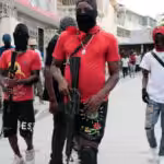 Soldiers of the G9 Family and Allies march in a protest against Prime Minister Ariel Henry in Port-au-Prince on Sep. 19, 2023. Photo: Odelyn Joseph/AP.