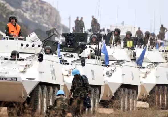 UNIFIL Peacekeepers driving in BTR-80 armored personnel carriers in South Lebanon. Undated. Photo: Al-Akhbar / Ali Hashisho