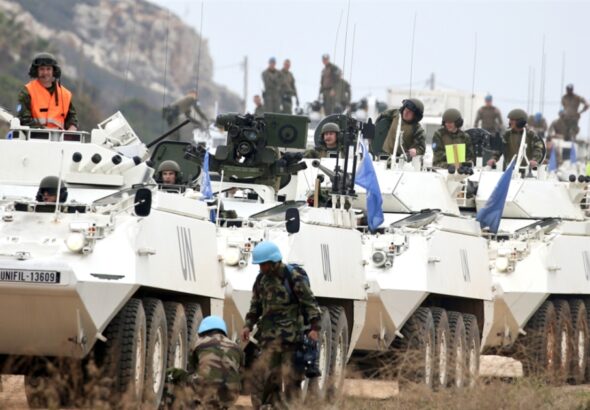 UNIFIL Peacekeepers driving in BTR-80 armored personnel carriers in South Lebanon. Undated. Photo: Al-Akhbar / Ali Hashisho