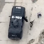 Satellite image of a Haitian police officer brutally gunning down a civilian. Photo: Uncaptured Media.