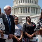 Rep. Alexandria Ocasio-Cortez (right) speaks at an event with Sen. Bernie Sanders and Rep. Ilhan Omar (left) outside the US Capitol in June. Photo: Saul Loeb/AFP/file photo.