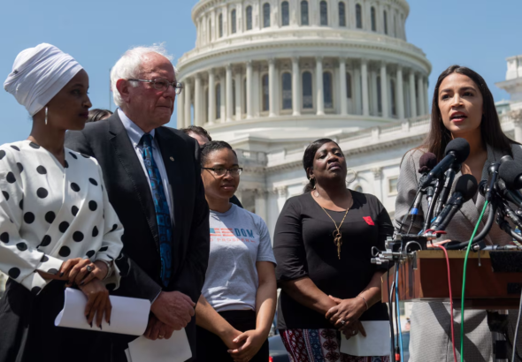 Rep. Alexandria Ocasio-Cortez (right) speaks at an event with Sen. Bernie Sanders and Rep. Ilhan Omar (left) outside the US Capitol in June. Photo: Saul Loeb/AFP/file photo.