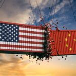 Two containers emblazoned with the Chinese and American flags colliding. Photo: USC Today.