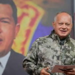 Diosdado Cabello speaks in front of an image of Hugo Chávez. Photo: Radio Habana Cuba.