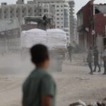 A truck carrying aid enters the Gaza Strip in May. Photo: Daoud Abu Alkass/AFP