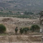 Israeli occupation forces are seen along a security fence gate near the so-called Alpha Line in the Israel occupied Syrian Golan Height, in the town of Majdal Shams, December 9, 2024. Photo: AP.