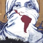 Street mural showing a face of a person crying with the face partially covered by a scarf with the map of Latin America and the Caribbean. Photo: Rebelion/file photo.