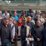 The Uhuru 3, their lawyers and supporters outside the courthouse after the sentencing hearing. Photo: Burning Spear.