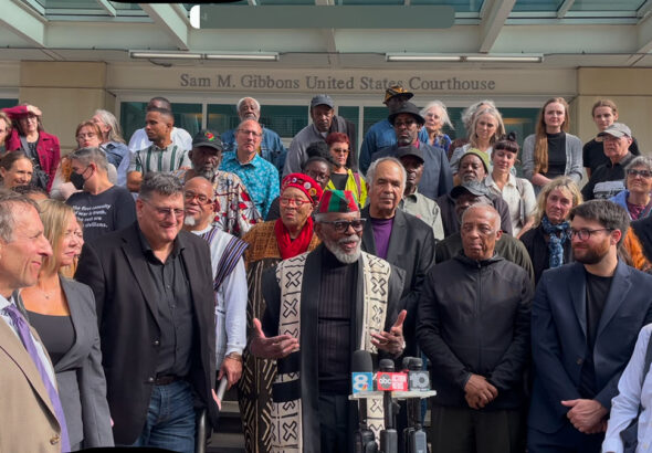 The Uhuru 3, their lawyers and supporters outside the courthouse after the sentencing hearing. Photo: Burning Spear.