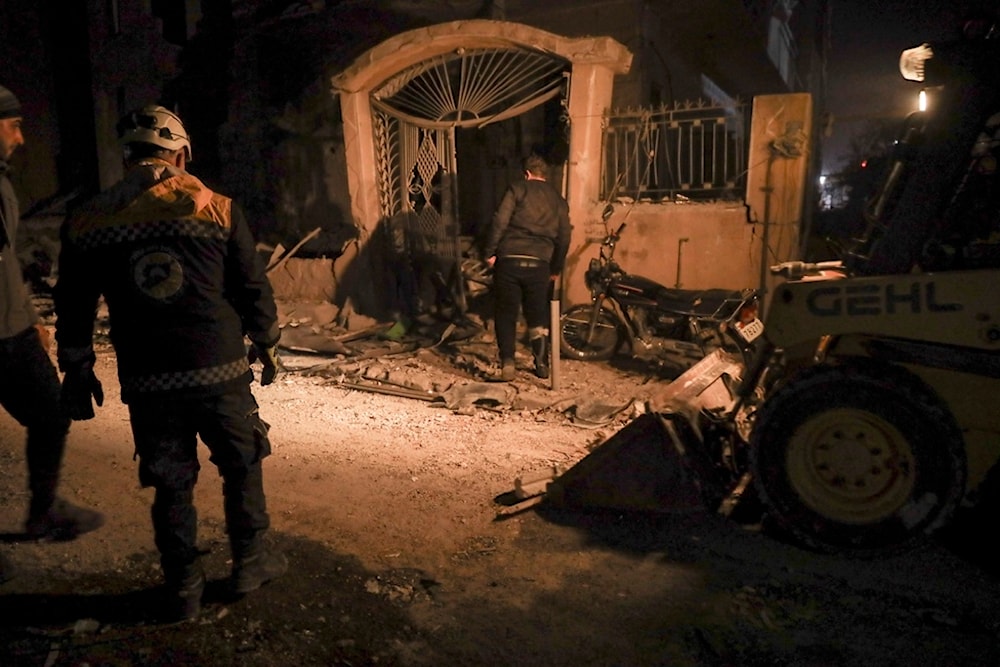 Residents inspect the site of an airstrike in Idlib, Syria, on Dec 1, 2024. Photo: AP.