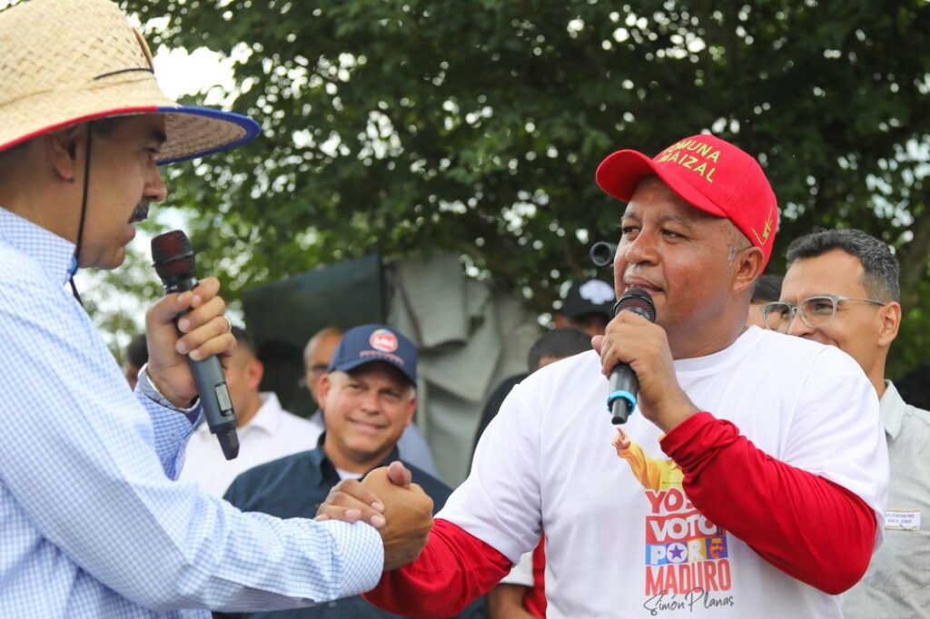 Featured image: Venezuela's Minister for Communes Angel Prado shakes hands with President Nicolás Maduro during a visit to the Comuna El Maizal in Lara state, July 2024. Photo: Presidential Press/file photo.