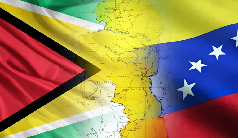 Photo composition showing the flags of Venezuela and Guyana, with a map of the Essequibo territory in between. File photo.