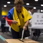 A woman votes in the Ecuadorian consultation and referendum in Madrid, Spain, April 21, 2024. Photo: Luis Soto.