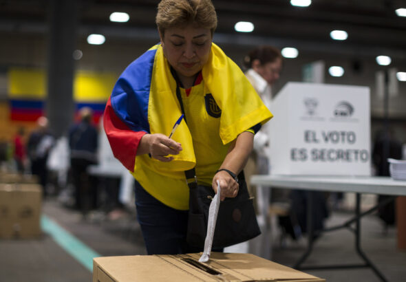 A woman votes in the Ecuadorian consultation and referendum in Madrid, Spain, April 21, 2024. Photo: Luis Soto.