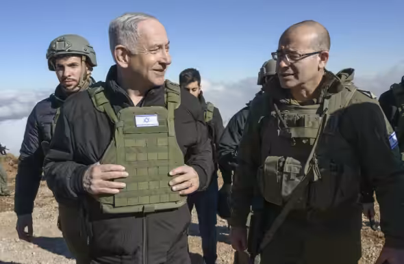 Israeli ruler Benjamin Netanyahu, left, visits Israeli invasion forces in the so called buffer zone inside Syria, Tuesday, December 17, 2024. Photo: Israeli occupation entity Press Office/AP.