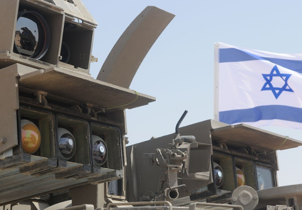 Part of an Israeli tank, with the Zionist entity's flag flying on it. File photo.