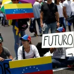 A small crowd gathers in support of María Corina Machado. Photo: C.G. Rawlins/Reuters.