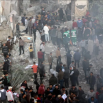 Displaced Palestinians and civil defense personnel outside the Kamal Adwan Hospital in Beit Lahia, northern Gaza, destroyed by Israeli aggression. Photo: Quds News Network.