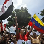 Venezuelans demonstrate in support of Syrian President Bashar al-Assad in front of the Syrian embassy in Caracas two weeks after the outbreak of a Western-manufactured color revolution in the country, April 1, 2011. Photo: Leo Ramirez/AFP/Getty Images/file photo.