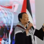 Leila Kahlid speaking at a recent international solidarity conference with Palestine in Venezuela. Photo: Resumen Latinoamericano.