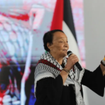 Leila Kahlid speaking at a recent international solidarity conference with Palestine in Venezuela. Photo: Resumen Latinoamericano.