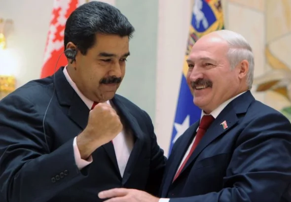 Venezuelan President Nicolas Maduro with his fist high alongside Belorussian President Aleksandr Lukashenko. File photo.