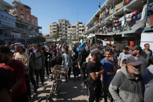 Palestinians gather to receive aid distributed by UNRWA, the UN agency helping Palestinian refugees, in Nuseirat refugee camp, Gaza, Palestine, on November 5, 2024. Photo: Al Mayadeen.