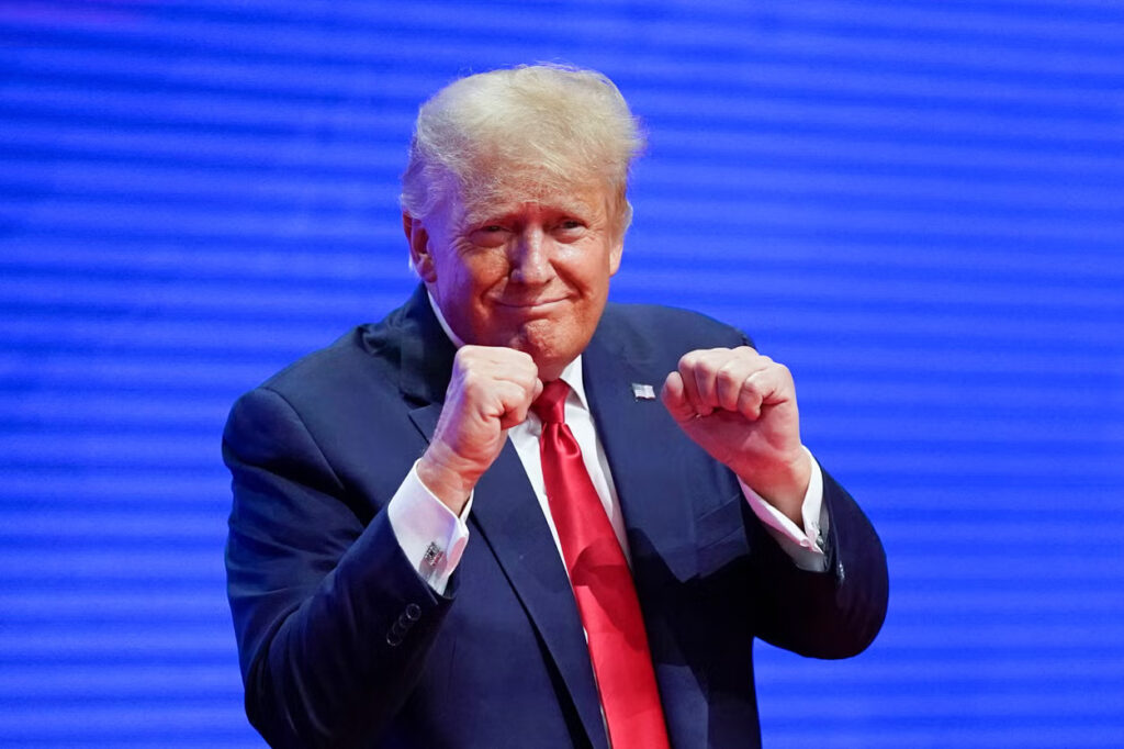 US President-elect Donald Trump making a boxing gesture at the CPAC in Florida in 2022. Photo: AP.