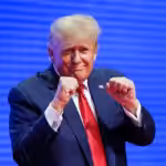 US President-elect Donald Trump making a boxing gesture at the CPAC in Florida in 2022. Photo: AP.