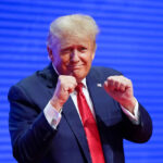 US President-elect Donald Trump making a boxing gesture at the CPAC in Florida in 2022. Photo: AP.