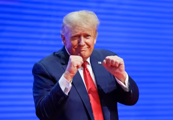 US President-elect Donald Trump making a boxing gesture at the CPAC in Florida in 2022. Photo: AP.