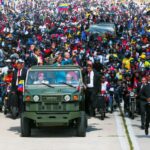 Venezuelan President Nicolas Maduro waves to supporters at the Los Proceres, Caracas, on his way to the Military Academy for a post-inauguration ceremony. He is accompany by his wife Deputy Cilia Flores and the vehicle is driven by Defense Minister Diosdado Cabello. January 10, 2025. Photo: X/@la_iguanatv.