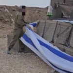 Israeli soldiers remove the Israeli flag from the Netzarim axis. Photo: Palestine Chronicle.