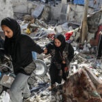 Palestinians in Nuseirat camp, Gaza Strip, after an Israeli bombardment. Photo: Abed Rahim Khatib/Zuma Press.