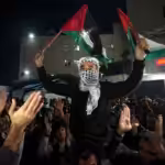 Palestinians in Deir al-Balah, central Gaza, celebrate the announcement of a ceasefire deal between the Palestinian Resistance and the Zionist occupation in January 15, 2025. Photo: AP.