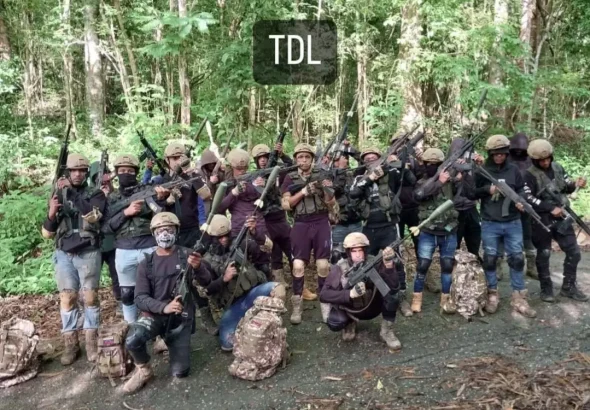 Members of the criminal gang Tren del Llano pose presumably in the mountains of Altagracia de Orituco, Guárico state, Venezuela, June 2023. Photo: Social media.