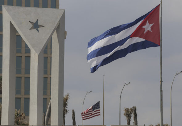 Cuban and US flags fly in the wind outside the US embassy in Havana, Cuba, Tuesday, Jan.14, 2025. Photo: Ariel Ley/AP.