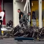 Colombian military personnel and police officers gather evidence at the site of a motor pump explosion in Jamundí, Colombia, in June 2024. Photo: Ernesto Guzman Jr./EFE