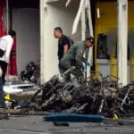 Colombian military personnel and police officers gather evidence at the site of a motor pump explosion in Jamundí, Colombia, in June 2024. Photo: Ernesto Guzman Jr./EFE