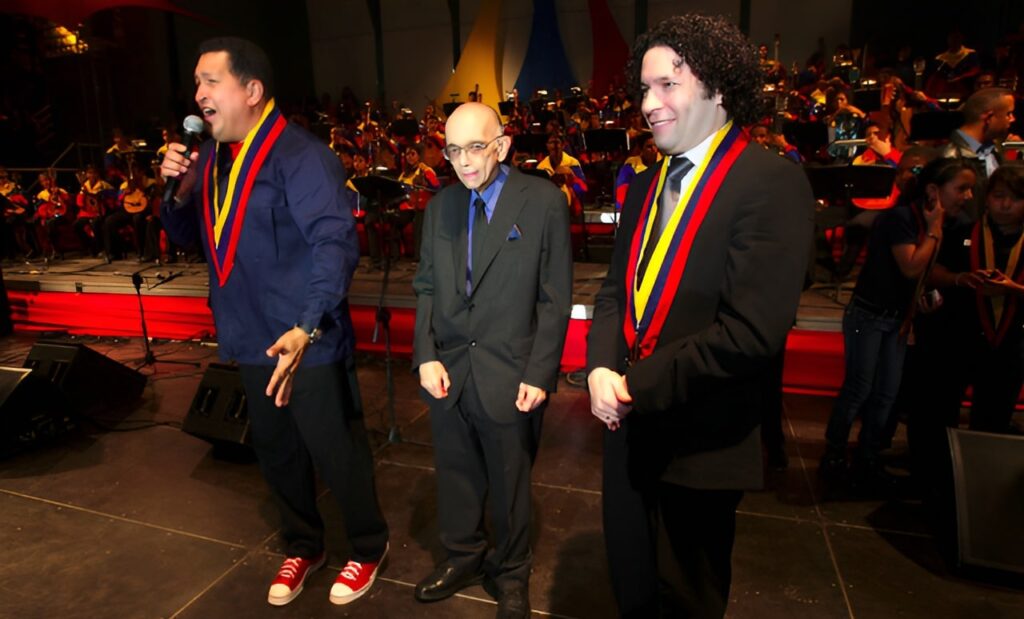 Late Venezuelan President Hugo Chávez (left), late maestro José Antonio Abreu (center), and Gustavo Dudamel (right), music director of the Simón Bolívar Symphony Orchestra and the Los Angeles Philharmonic. File photo.