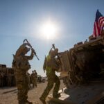 Crewmen enter Bradley fighting vehicles at a US military base at an undisclosed location in Northeastern Syria, on November 11, 2019.  Photo: AP/file photo.