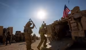 Crewmen enter Bradley fighting vehicles at a US military base at an undisclosed location in Northeastern Syria, on November 11, 2019.  Photo: AP/file photo.
