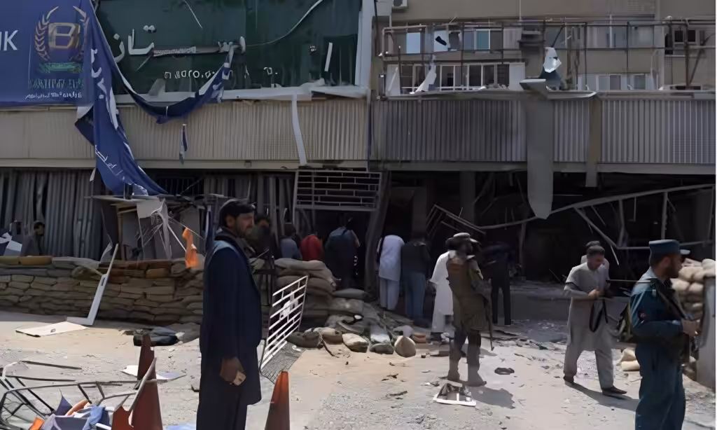 People gather outside the bank where a suicide bomber killed at least five people, Kunduz, Afghanistan, February 11, 2025. Photo: social media.
