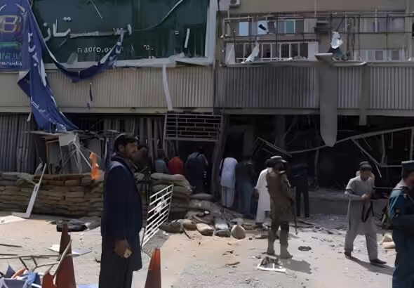 People gather outside the bank where a suicide bomber killed at least five people, Kunduz, Afghanistan, February 11, 2025. Photo: social media.