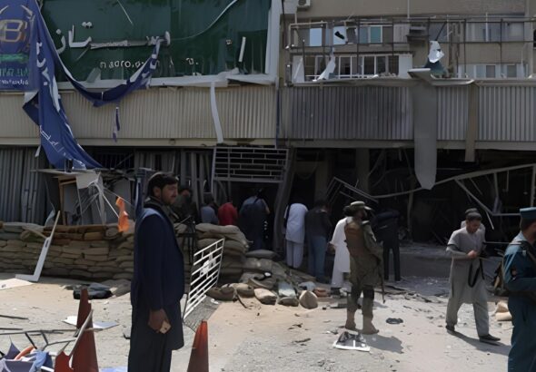 People gather outside the bank where a suicide bomber killed at least five people, Kunduz, Afghanistan, February 11, 2025. Photo: social media.