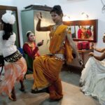 Transgender Bangladeshis dance as they prepare backstage before a transgender talent show, Nov 10, 2014 in Dhaka, Bangladesh. Photo: Allison Joyce/Getty Images.