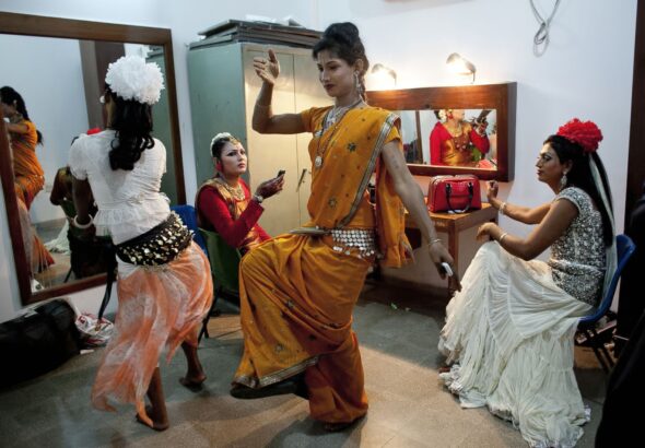 Transgender Bangladeshis dance as they prepare backstage before a transgender talent show, Nov 10, 2014 in Dhaka, Bangladesh. Photo: Allison Joyce/Getty Images.