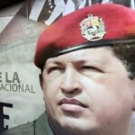 Mural in the streets of Caracas with a photo of Commander Hugo Chavez next to a caption that reads Dia de la Dignidad Nacional (National Dignity Day), and a photo of Chavez while he was in prison. Photo: ONCOP/file photo.