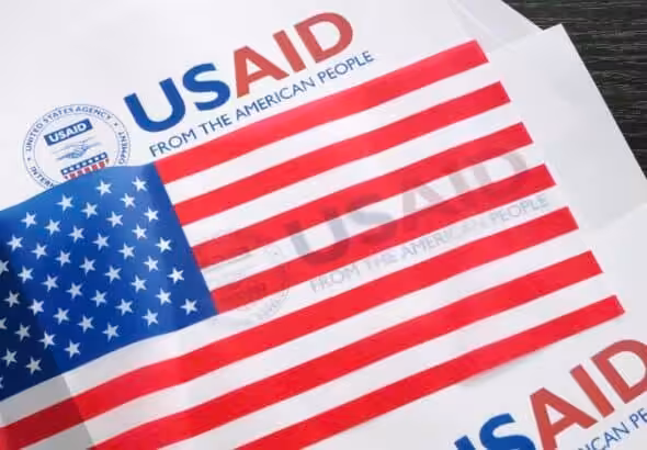 USAID logo and US flag. Photo: Kawsachun News/file photo.